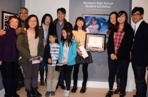 Audrey Seo (Grade 11, Staples High School) and her family next to her winning entry. Photo by Helen Klisser During.